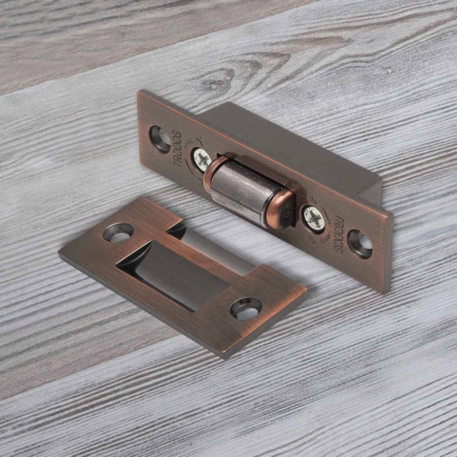 Фиксатор дверной Trodos роликовый, медь